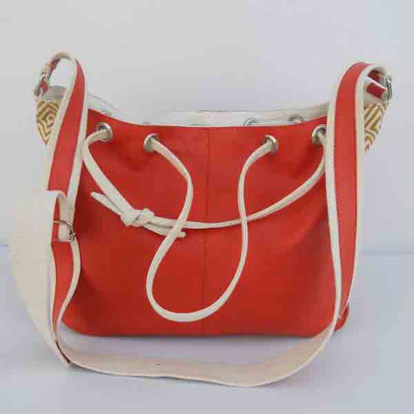 Red color leather purse with red natural cotton canvas handles .