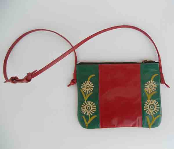 Red & green color leather red handle and green embroidered stripes only at front .