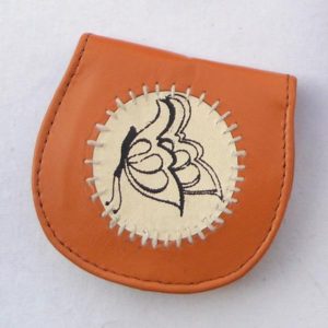 Brown leather coin pouch with a creame leather printed patch