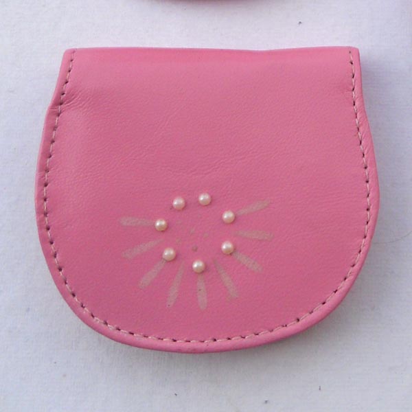 Pink color coin pouch with some pearls studded on the front.