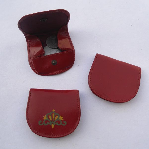 Red color coin pouch with two color print motif on the front.