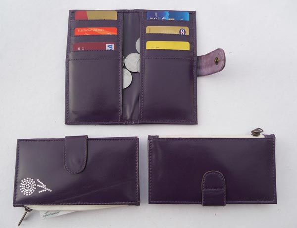 Blue leather with multiple pockets for credit cards & two large side pockets