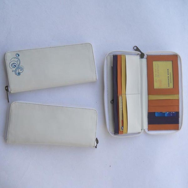White color leather with multiple pockets inside multiple color leather .