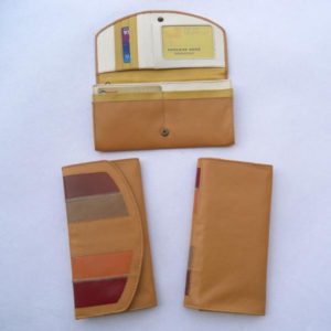 Beige color leather with multiple pockets multiple color leather.