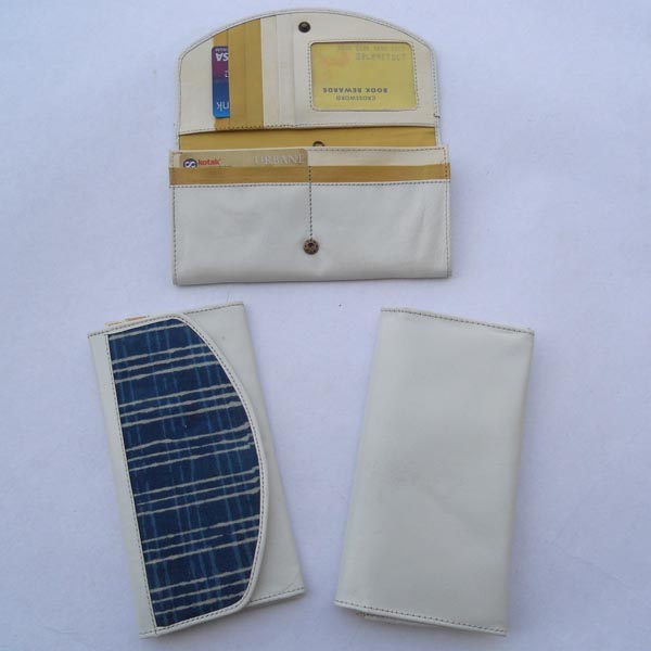 White color leather with multiple pockets with indigo batik printed cotton canvas.