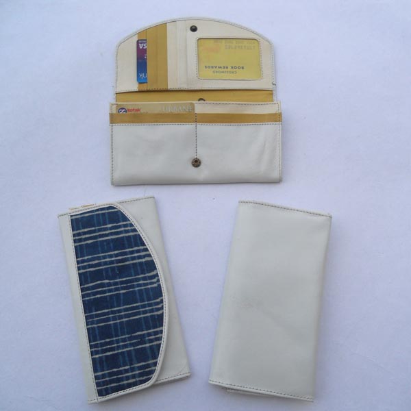 White color leather with multiple pockets with indigo batik printed cotton canvas.
