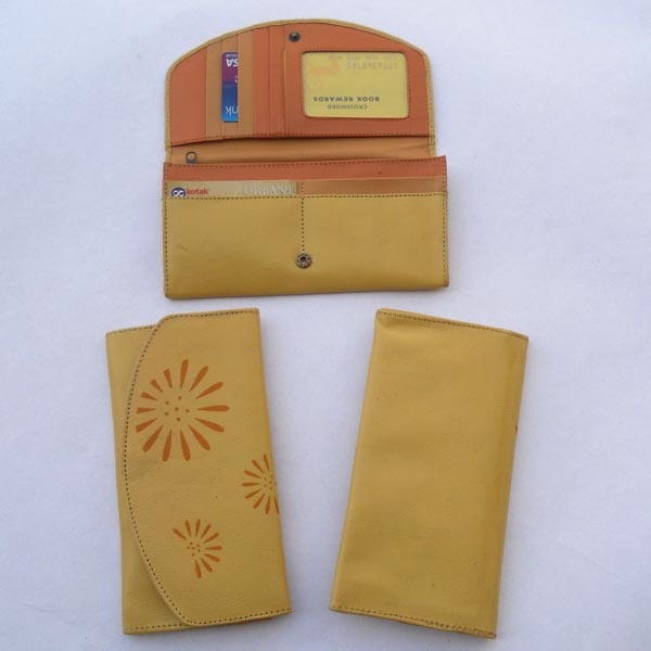 Pale yellow color leather with multiple pockets.