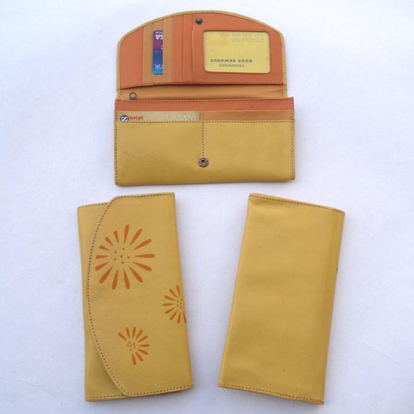 Pale yellow color leather with multiple pockets.