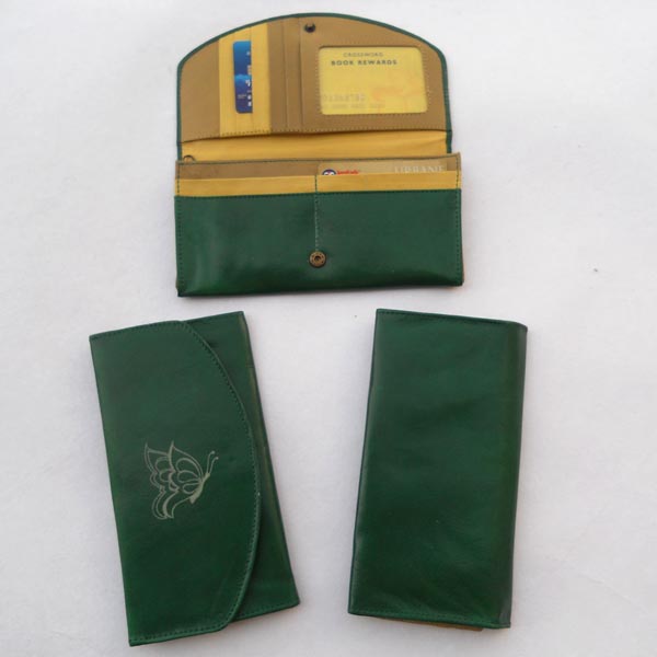 Green color leather with multiple pockets .