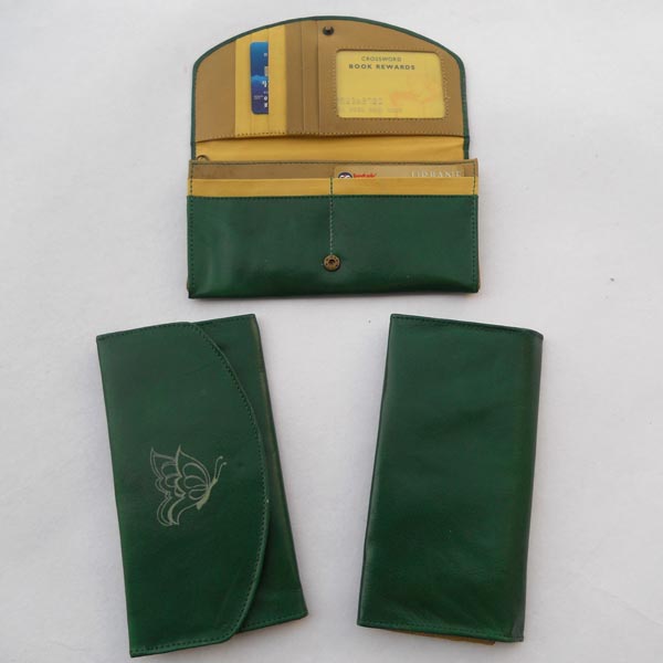 Green color leather with multiple pockets .