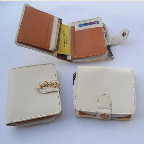 White color leather with multiple pockets outside embroidered stripe wallet .