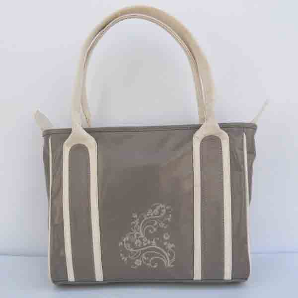 Grey color leather with fine print in the center of purse.